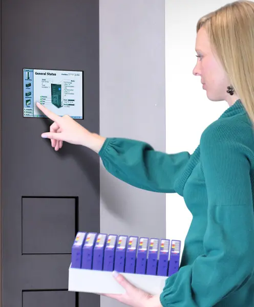 Loading TeraPack containers into the Spectra T680 Library, demonstrating efficient tape management and high-capacity data storage.